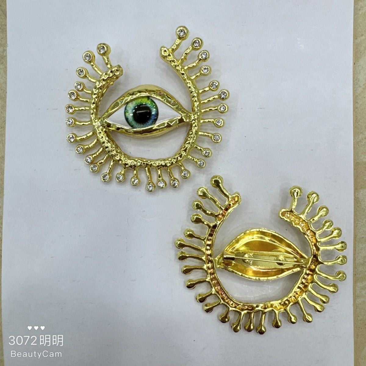 Gold Eye Brooch