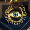 Gold Eye Brooch